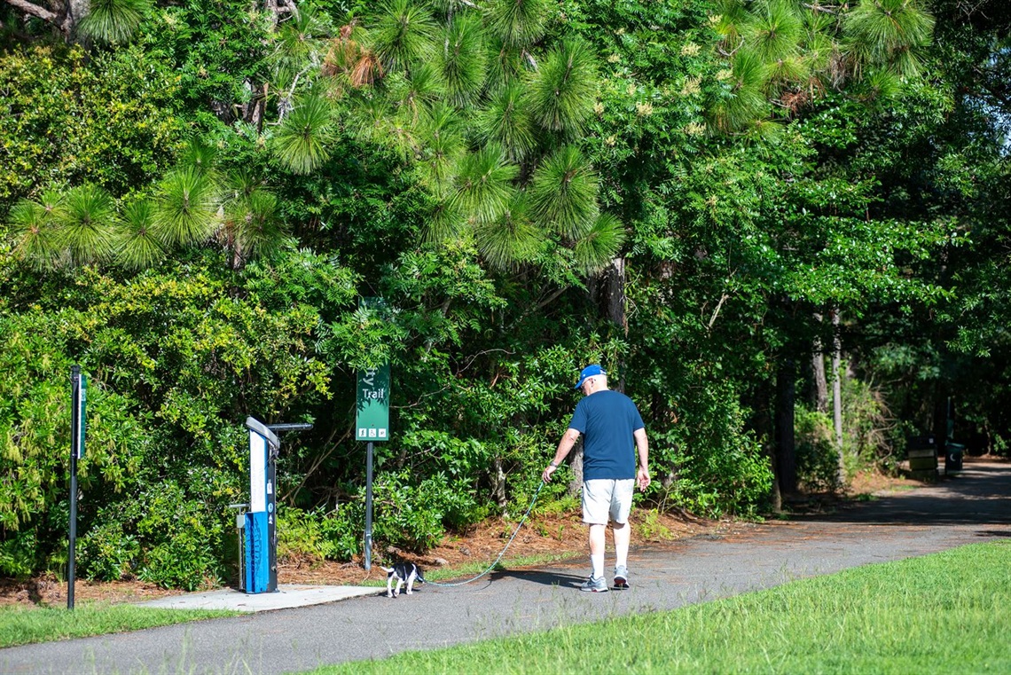 Man walking dog on Wilmington trail