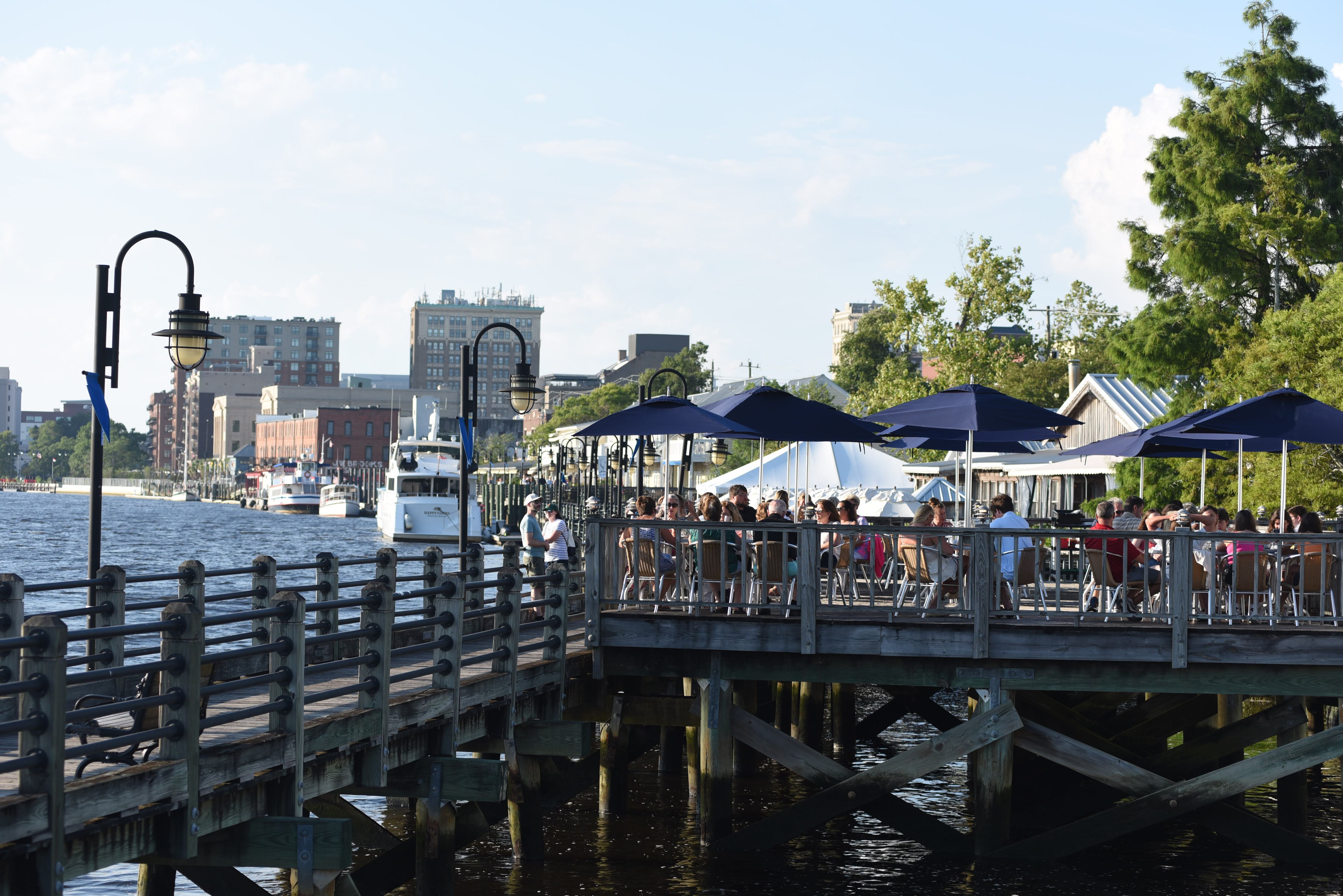 People enjoying a lovely day along the Wilmington Riverwalk